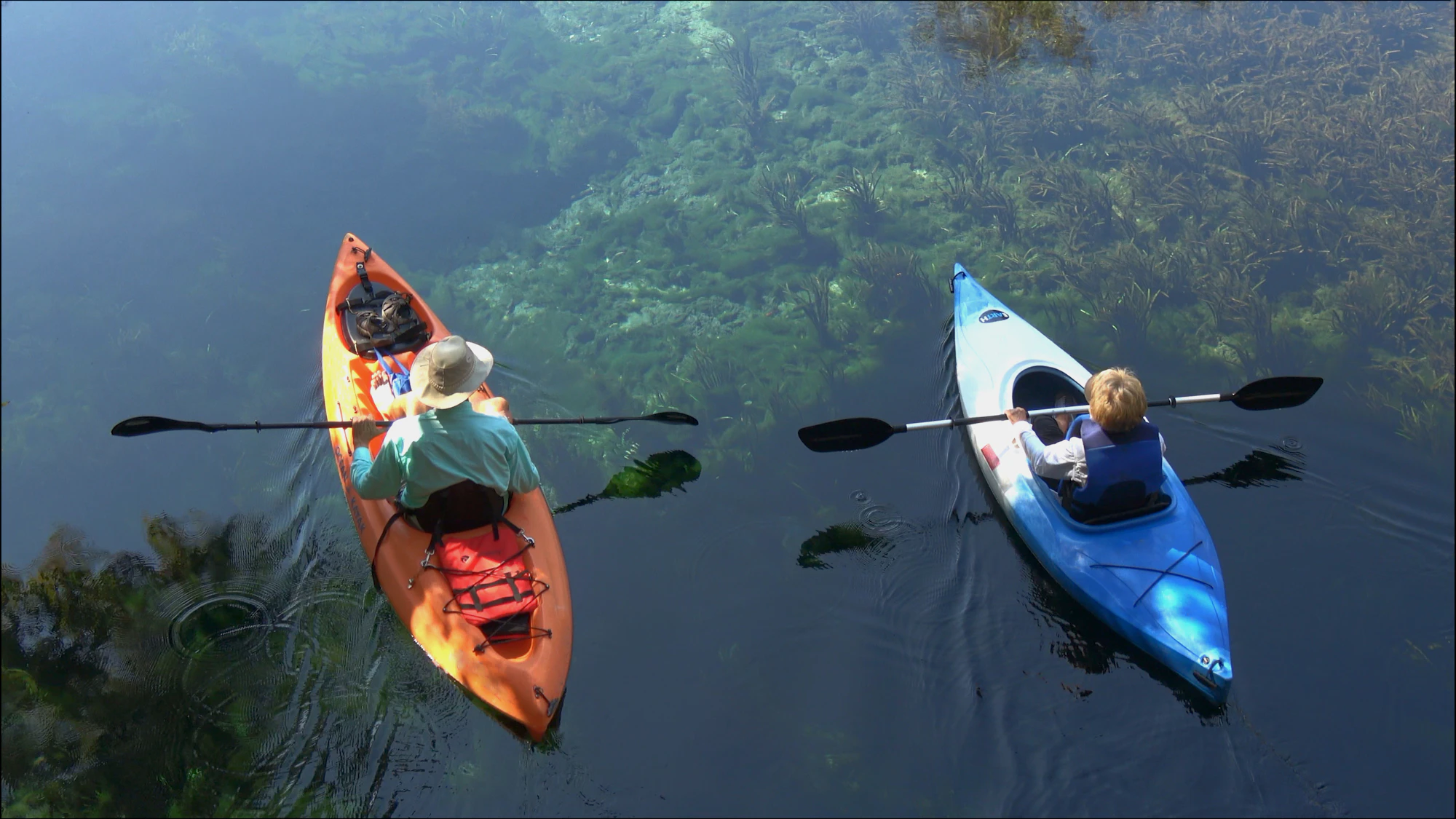 Two kayakers over clear spring water at Silver Springs State Park near Ocala
